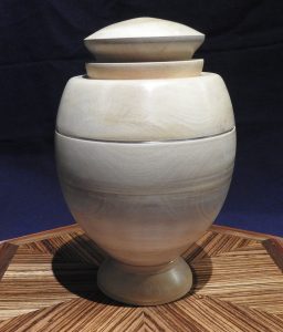Funeral urn in white holly and silver