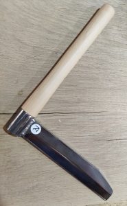 This is a standard froe with a fixed and wedged handle.